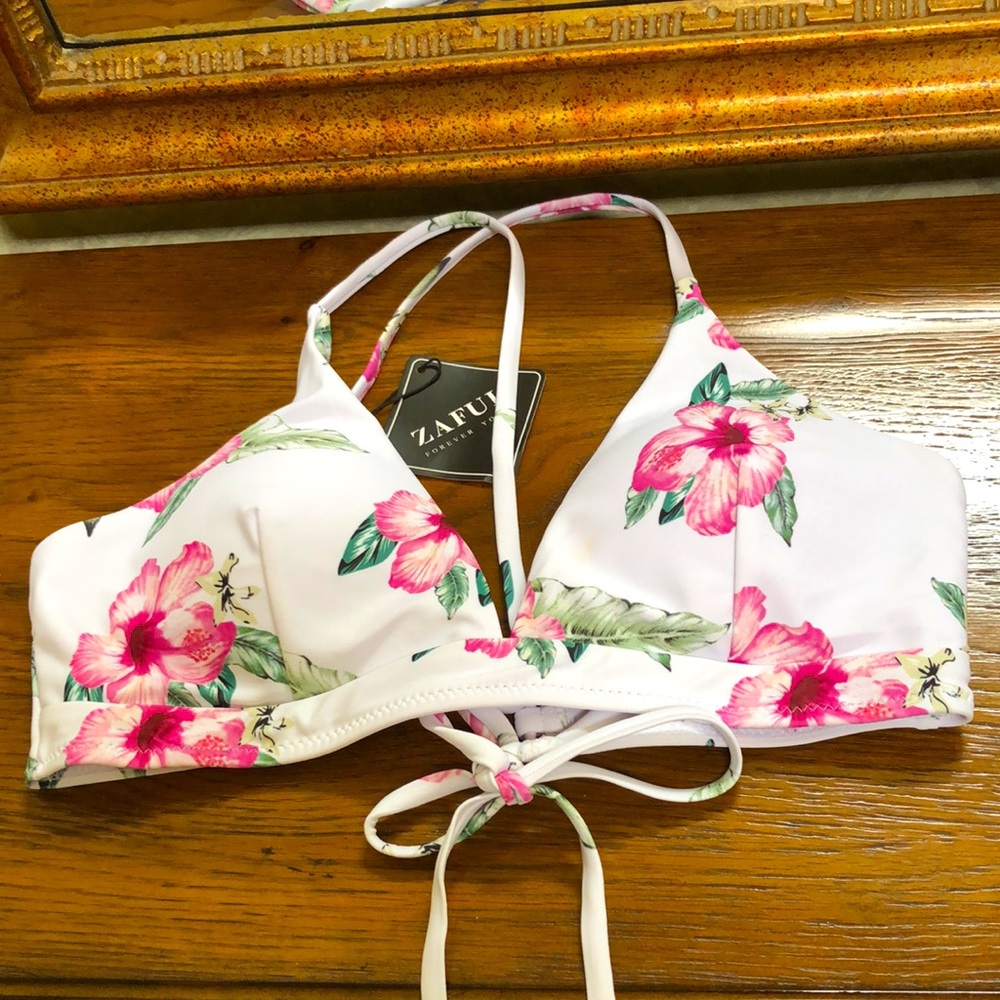 New Women’s swim top.  Size 8.  White with floral pattern.  Tie crisscross back.